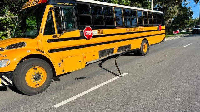 Driver dies after striking Florida bus carrying high schoolers