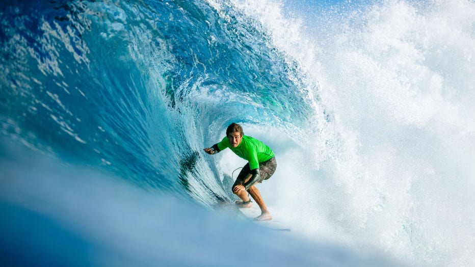 FILE - Kalani David of Hawaii advances to the quarterfinals of the Pipe Invitational, the trials of the 2019 Billabong Pipe Masters after winning Heat 3 of Round 1 at Pipeline on December 9, 2019, in Oahu, United States. (Photo by Ed Sloane/WSL via Getty Images)
