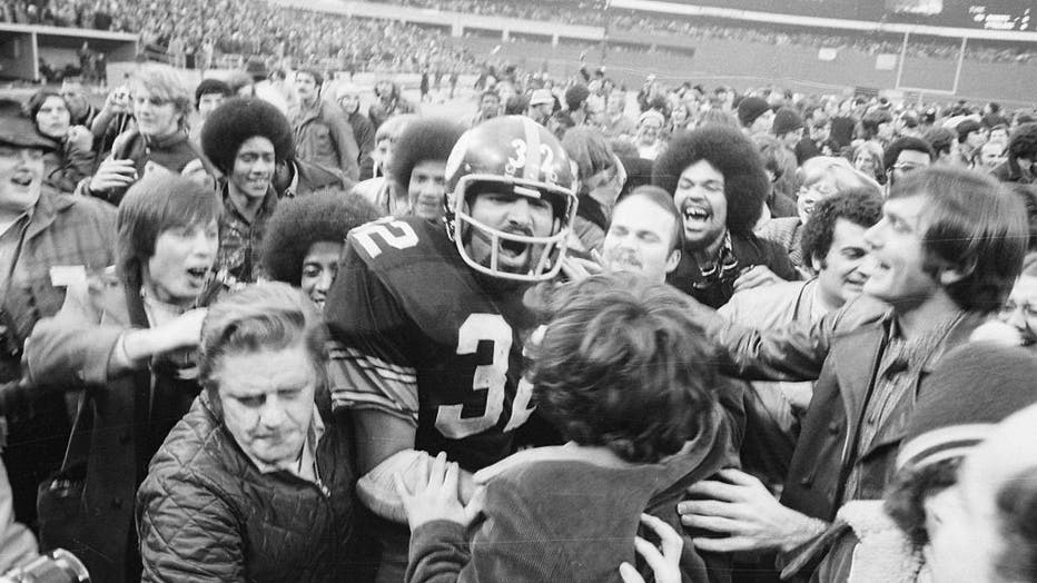 Fans Mob Franco Harris of the Pittsburgh Steelers