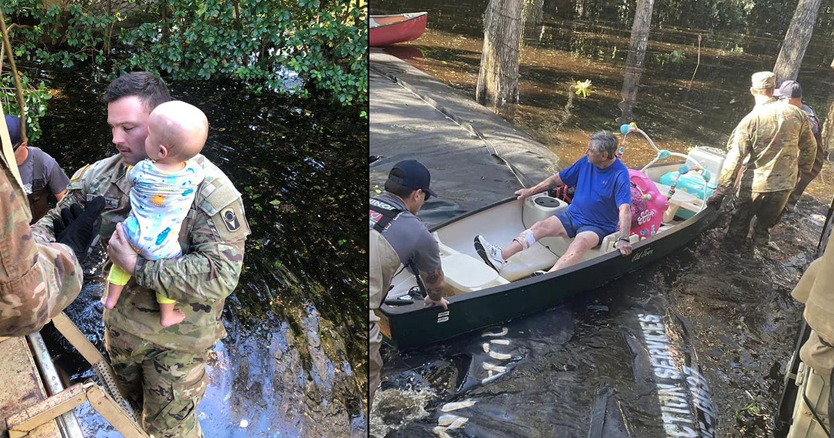 Firefighters rescue baby, dogs and cats from Hurricane Ian floodwaters ...