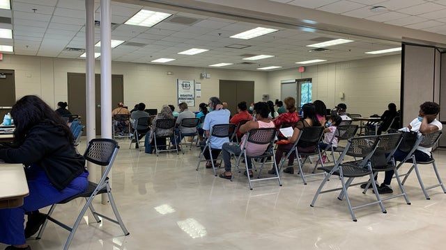 People line up for hurricane relief aid from FEMA in Orange County
