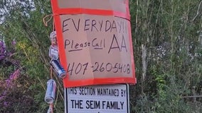 Man publicly shaming beer can litter bugs with phone number to AA group posted on sign