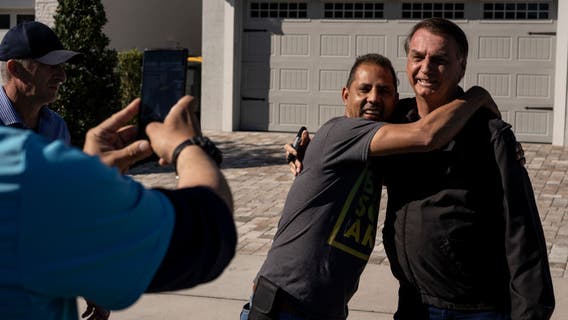 Bolsonaro eyes return to Brazil as US stay pressures Biden