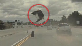 WATCH: Car goes airborne, flips on Los Angeles freeway after hitting tire that popped off truck
