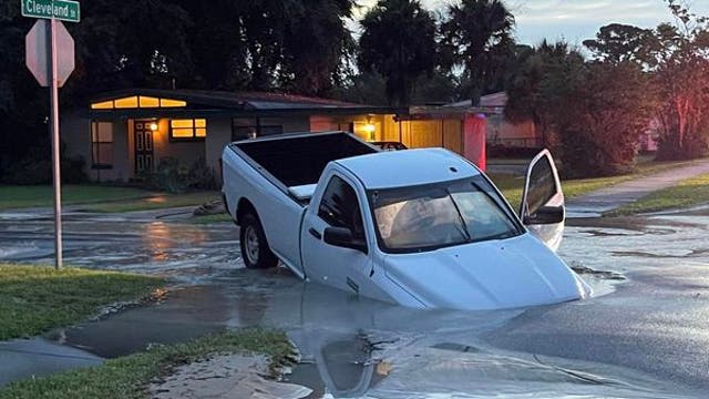 Massive sinkhole nearly swallows pickup truck in Titusville neighborhood