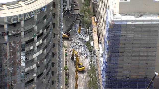 Photos: Scaffolding tumbles onto downtown Orlando streets, creating massive mess