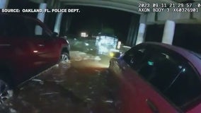 Florida police officers rescue stranded drivers from flooded underpass