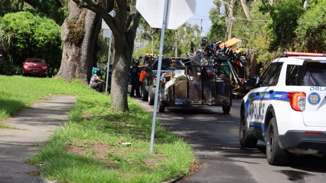 Public nuisance or art? Orlando man forced to get rid of pile of items strapped to van