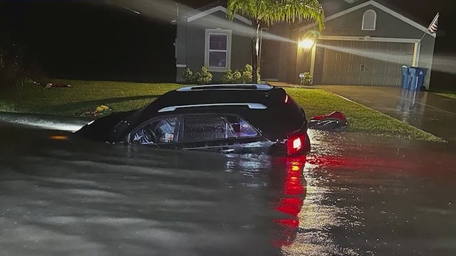 'Terrified': Cars stuck in ditches after 19 inches of rain drenches parts of Palm Bay