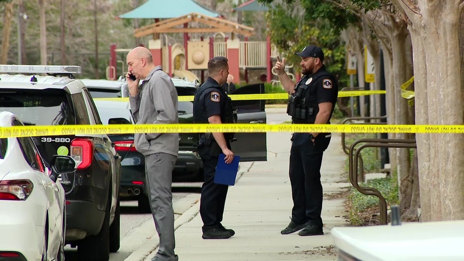 Law enforcement officers and crime scene tape at location where police say an 8-year-old Pinellas County girl was abducted.