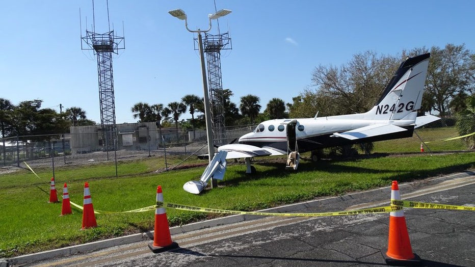 Investigators say the plane was found in the grass with a broken wing and its door open. Image is courtesy of the Lee County Sheriff's Office.