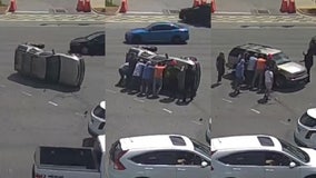Good Samaritans help overturn SUV that flipped in crash at busy Daytona Beach intersection: WATCH