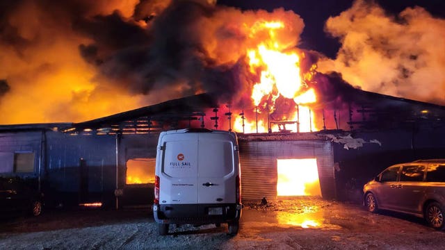 Massive fire rips through abandoned auto shop in Winter Park overnight