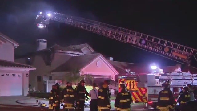 Orlando firefighters battle house fire in Conway