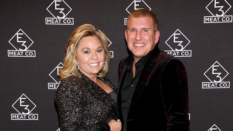 NASHVILLE, TENNESSEE - NOVEMBER 20: Julie Chrisley (L) and Todd Chrisley attend the grand opening of E3 Chophouse Nashville on November 20, 2019 in Nashville, Tennessee. (Photo by Danielle Del Valle/Getty Images for E3 Chophouse Nashville)