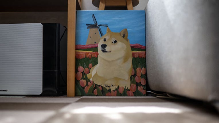 FILE - This picture taken on March 19, 2024, shows a painting of Japanese shiba inu dog Kabosu, best known as the logo of cryptocurrency Dogecoin, at the home of her owner Atsuko Sato in Sakura, Chiba prefecture, east of Tokyo. (Photo by PHILIP FONG/AFP via Getty Images)
