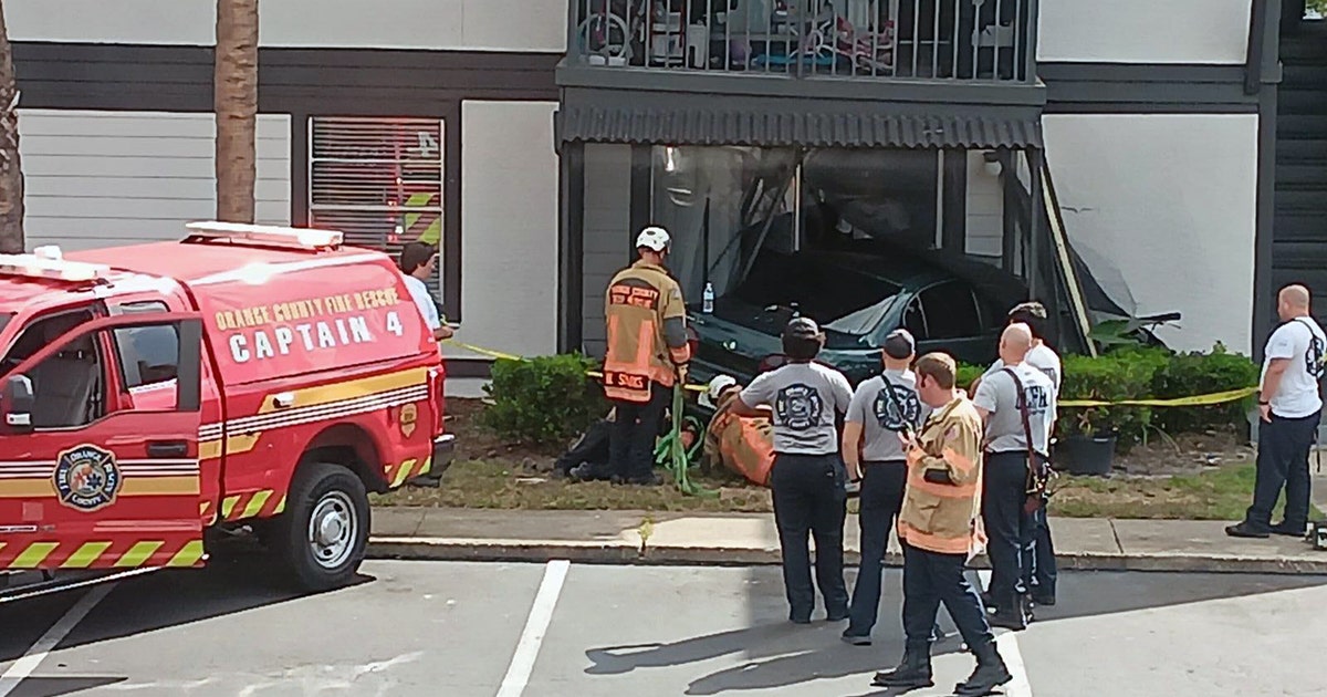Orange County firefighters respond after car crashes into apartment ...