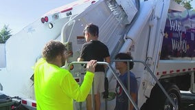 Children at Give Kids The World Village get up-close look at garbage trucks