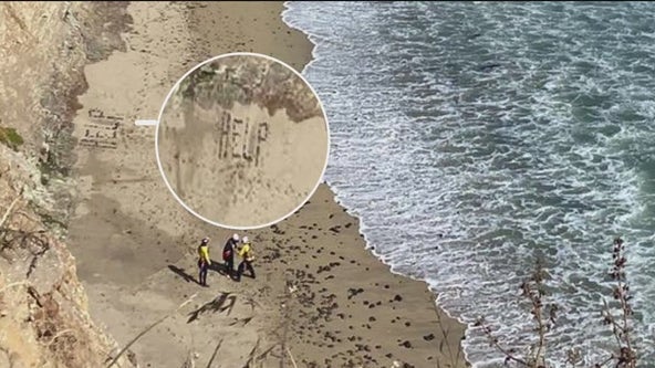 Kite surfer spells HELP in sand; prompts Santa Cruz rescue