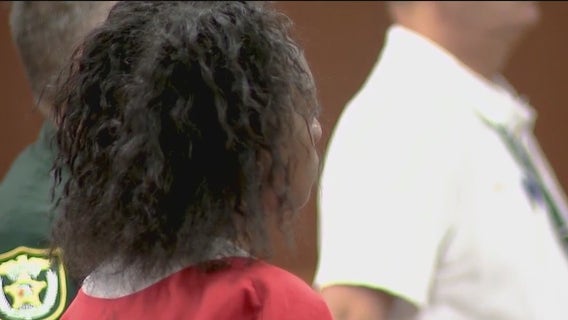 Woman accused in death of boyfriend's 9-year-old daughter to remain in jail
