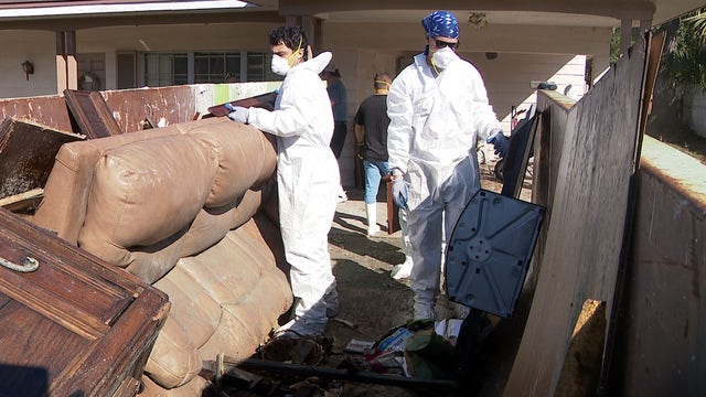 Hazmat crews clean out DeLand home flooded after Hurricane Milton, hoping for restoration