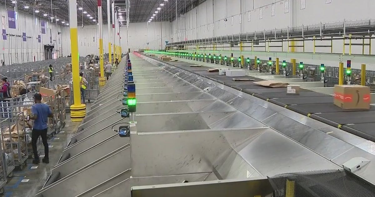 Behind the scenes: Amazon warehouse buzzing on Cyber Monday | FOX 35 ...