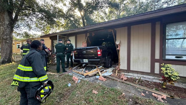 Dog, person injured after truck crashes into Volusia County home, officials say