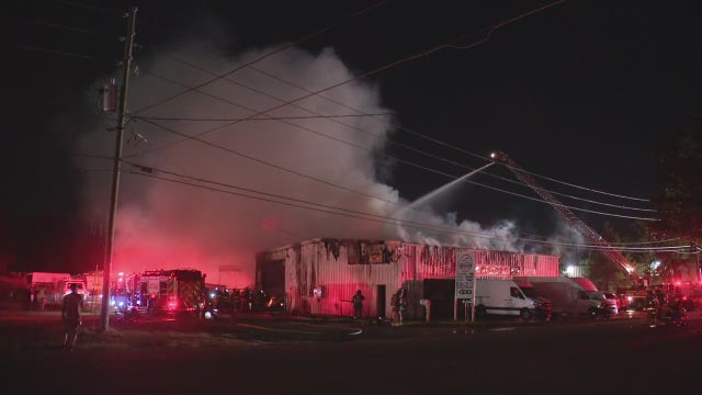 Firefighters battle large warehouse fire in Orange County