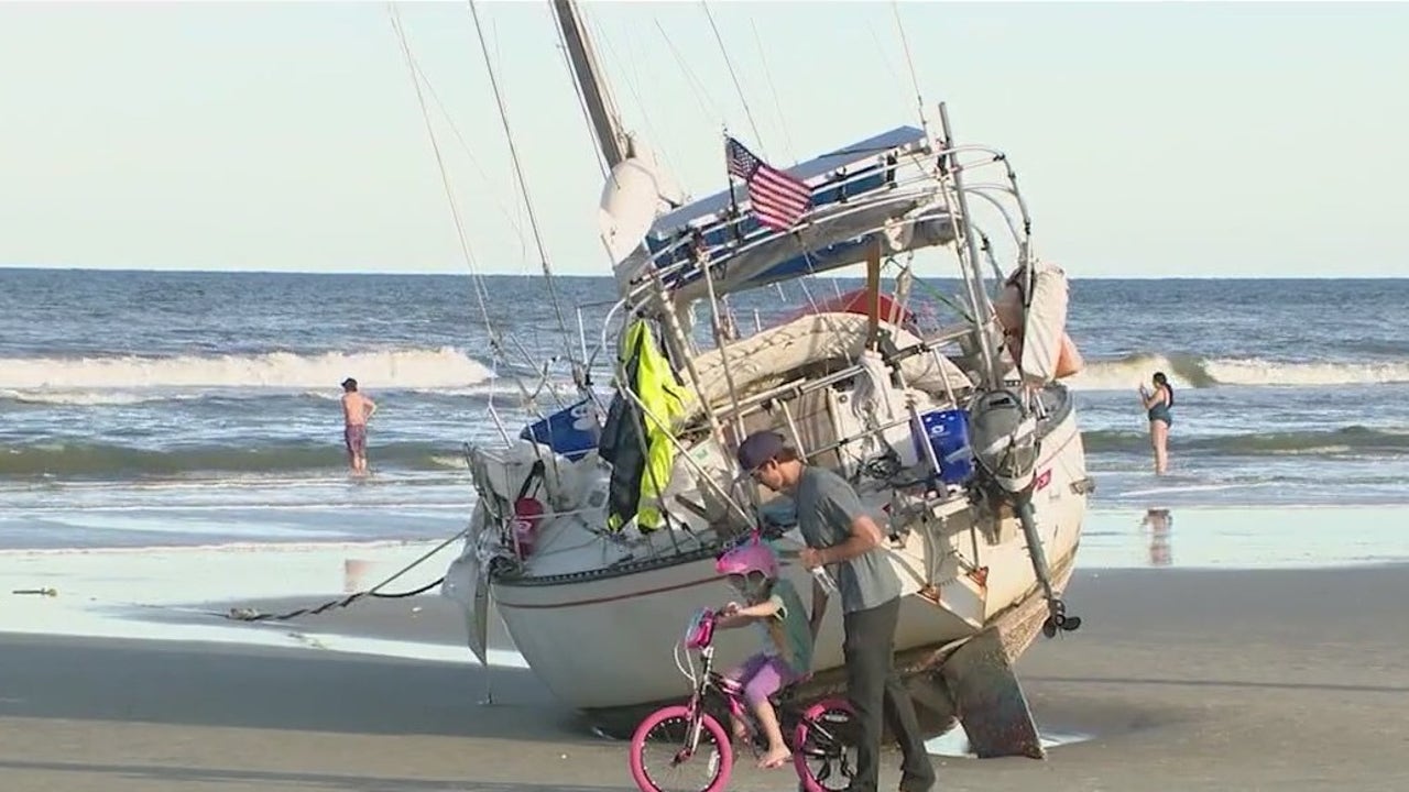 Owner of stranded sailboat on Florida beach says a deal in the works to surrender boat
