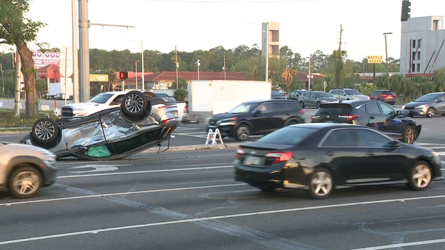 Crash involving overturned vehicle blocks traffic at Orlando intersection; 1 hospitalized