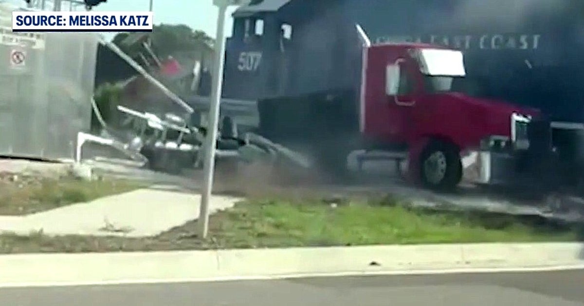 Freight train slams into semi-truck stalled on tracks in Florida | FOX ...