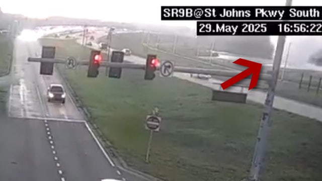 Tornado spins by Florida traffic camera