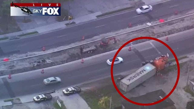 Semi-truck runs off road, overturns in Pine Hills: Troopers