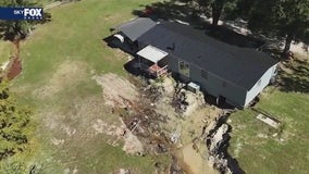 Torrential rain carves massive gully under Mount Dora house, displacing family