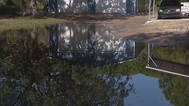 FDOT, train company file complaints after Florida homeowner uses pump to clear yard of flooding