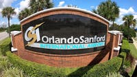 Private plane slides off Orlando Sanford International Airport runway