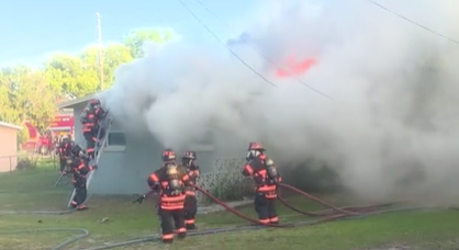 2 killed after car crashes into home and sparks fire, officials say