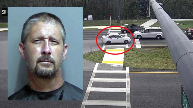 Driver arrested after traveling in reverse on S.R. 100: 'World's best backwards driver'