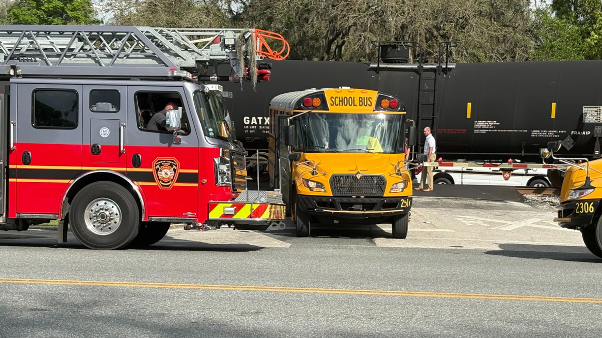 Florida school bus driver arrested after train crash with 29 students onboard