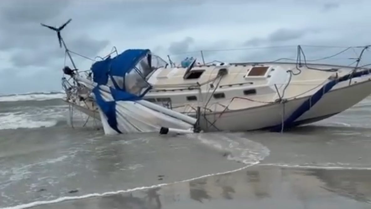 Rough weather strands sailboats in New Smyrna Beach