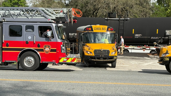 Florida school bus driver arrested after train crash with 29 students onboard