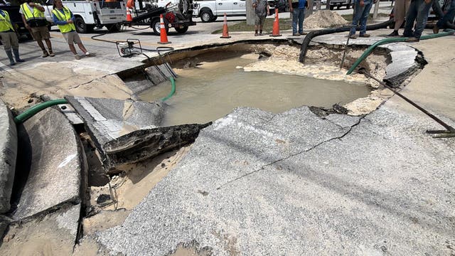 Water main break opens large crater, closes DeLand road