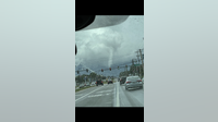 Tropical funnel cloud forms in Melbourne