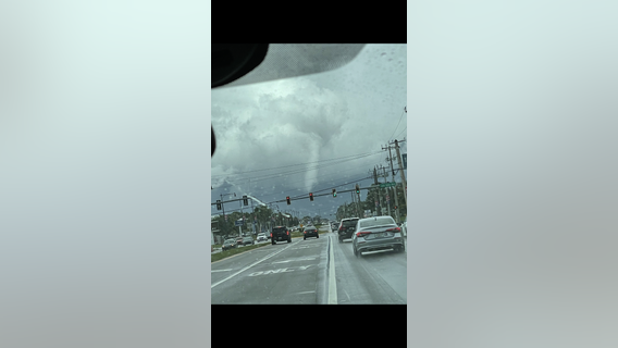 Tropical funnel cloud forms in Melbourne