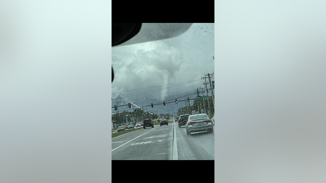 Tropical funnel cloud forms in Melbourne