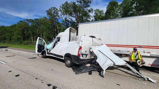 Van crushed after hitting parked semi-truck; no one seriously hurt, FHP says