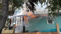 Fire crews respond after flames rip through Orlando home, officials say