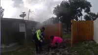 Officer, neighbor rescue trapped dog from lightning-sparked Ocoee house fire