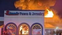 Photos: Massive fire at Kissimmee pawn shop; 1 firefighter hurt, official says