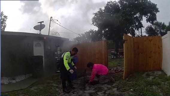 Officer, neighbor rescue trapped dog from lightning-sparked Ocoee house fire